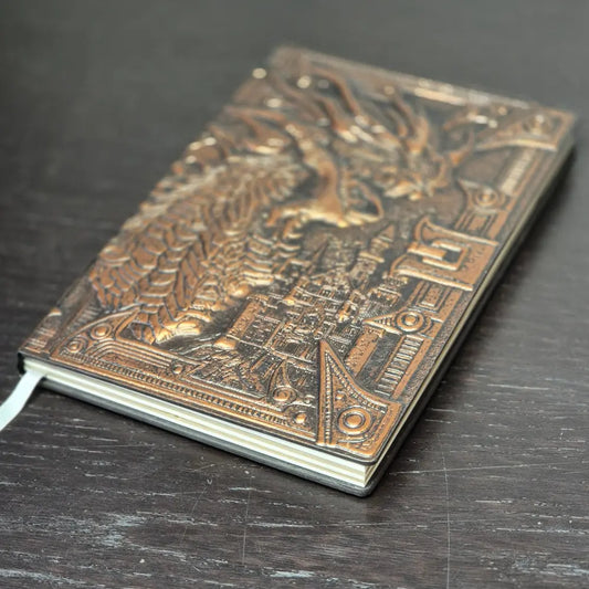 A bronze coloured notebook/journal for DND and other TTRPG games