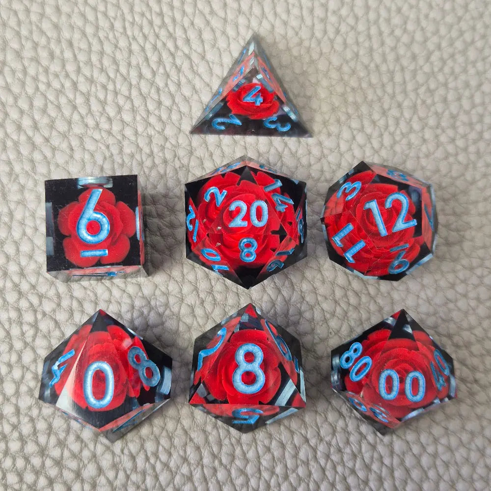 A set of clear sharp-edge resin dice with black ground color and red rose inside.