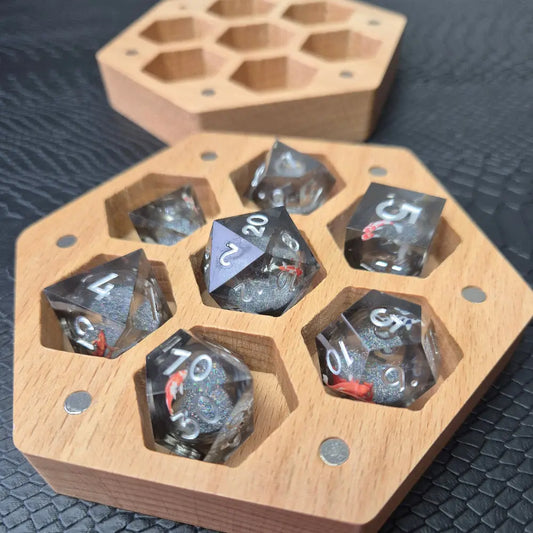 A Wooden Hexagon shaped dice storage box with magnets on a black textured surface