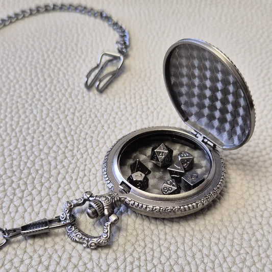 A silver coloured full metal pocket watch themed dice locket, with engraved backside and detailed kraken on the front. Contains full set of metal dice inside
