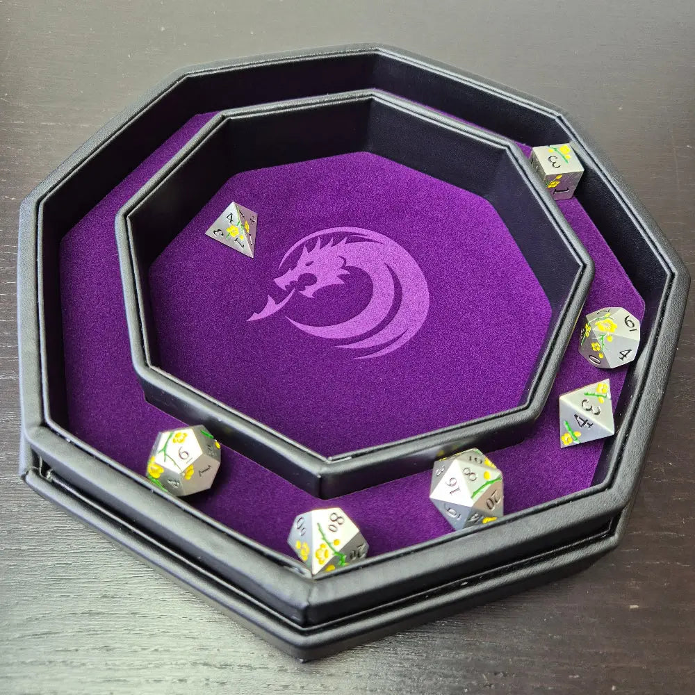 Purple double-layered octagonal dice tray with black borders and a violet dragon emblem in the center, displayed on a textured surface.