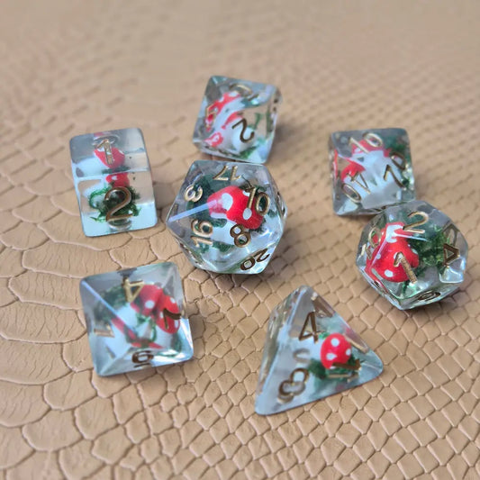 Clear resin D&D dice with red mushroom and moss encased inside, golden numbers, set on a textured leather background.