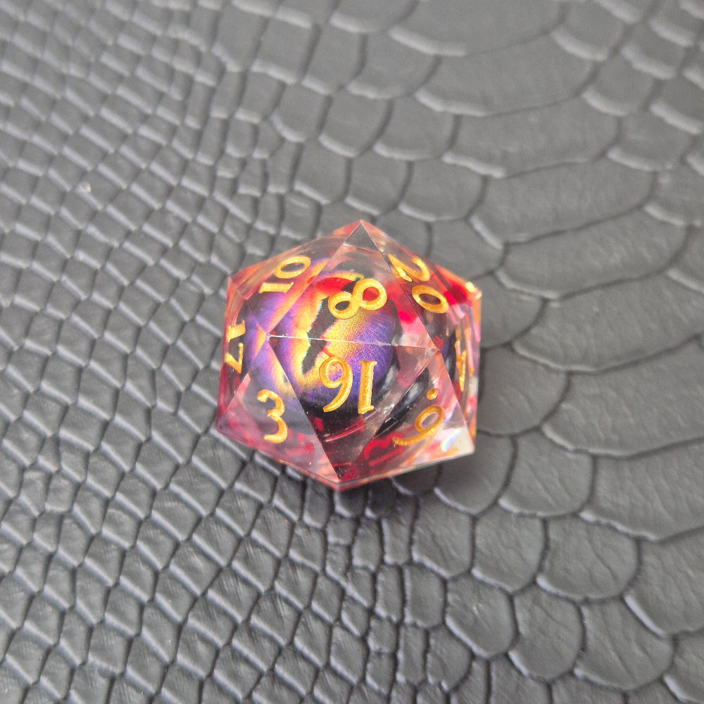A set of clear red tinted liquid core resin dice with a moving dragon eye inside, displayed on a black textured surface